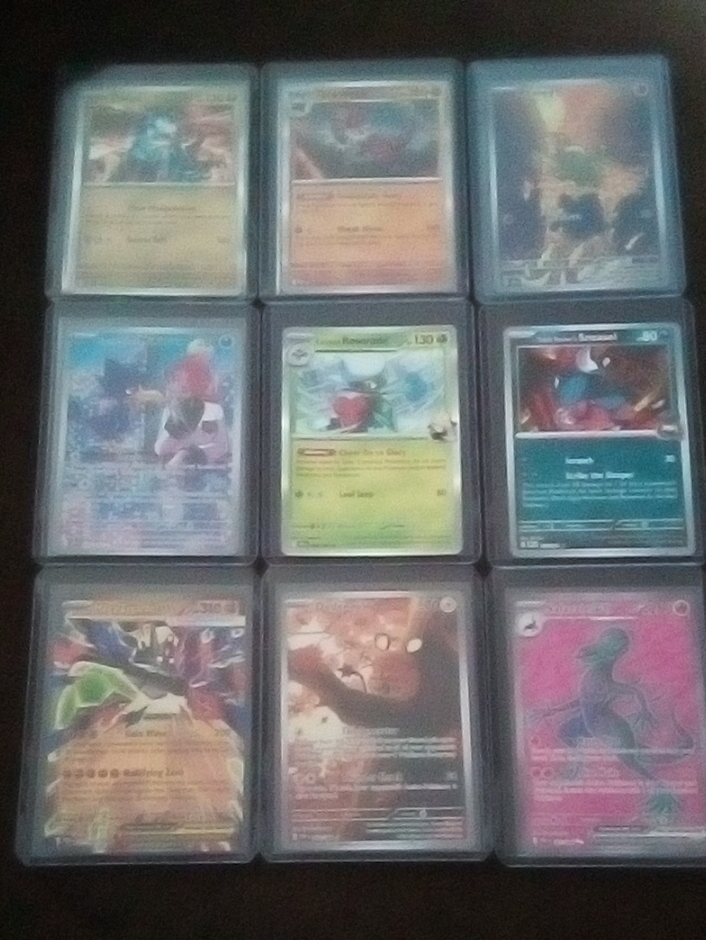 Pokemon Card Lot in Blue-Edged Protective Sleeves with Pink and Green Accents